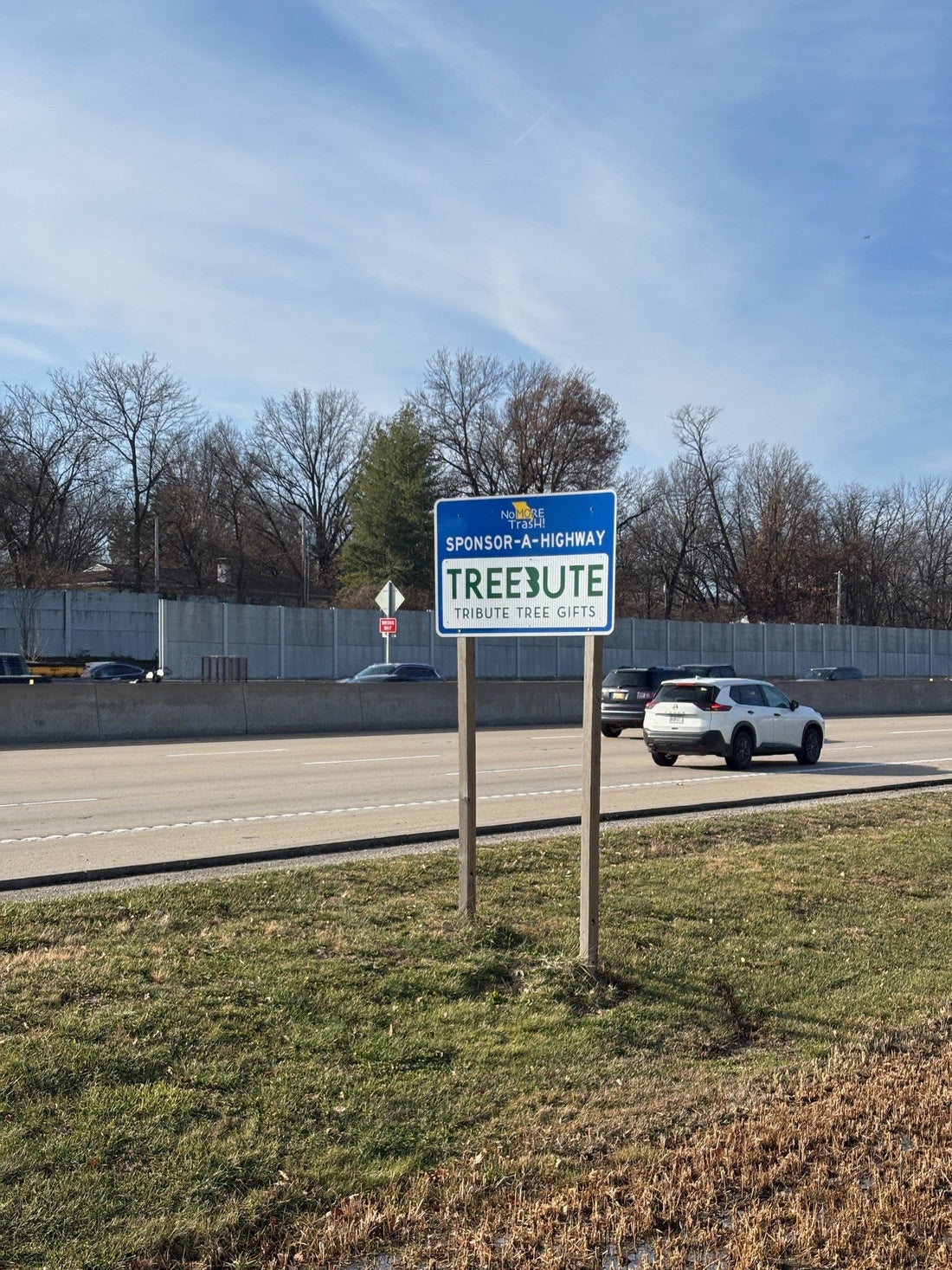 Treebute highway sponsorship photo showing commitment to honoring life and healing the planet - Community volunteers collecting roadside litter during Treebute’s ongoing cleanup campaign in Missouri